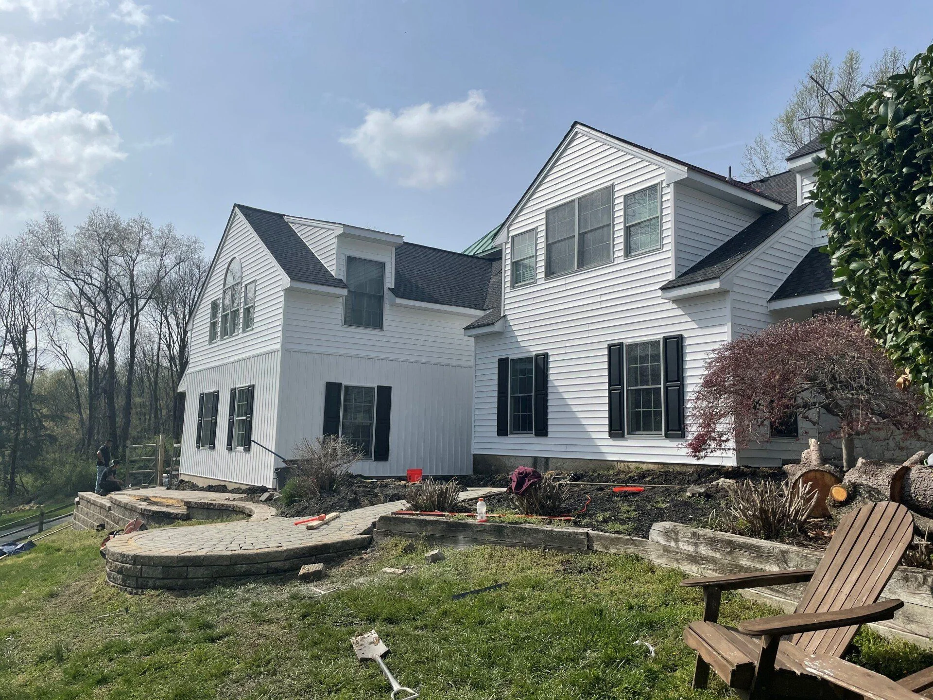 White home exterior during improvement work